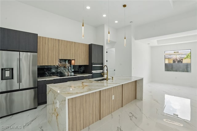 103 Chiquita Blvd N, Cape Coral, FL 33993 - kitchen featuring stainless steel appliances, light marble finish floors, a sink, modern cabinets, and light stone countertops