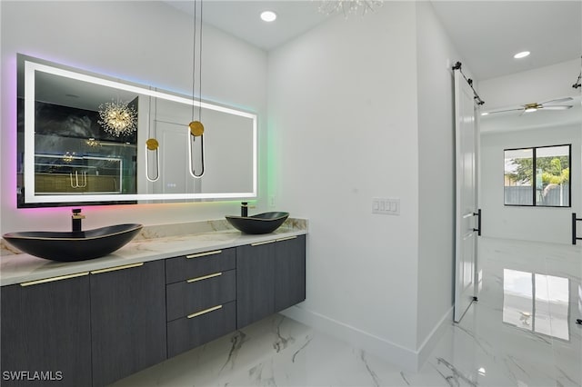 103 Chiquita Blvd N, Cape Coral, FL 33993 - bathroom with double vanity, a marble finish shower, marble finish floors, baseboards, and recessed lighting