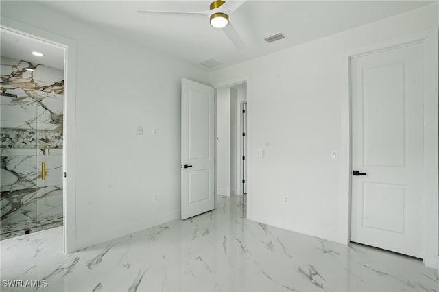 103 Chiquita Blvd N, Cape Coral, FL 33993 - unfurnished bedroom with marble finish flooring, baseboards, and a ceiling fan