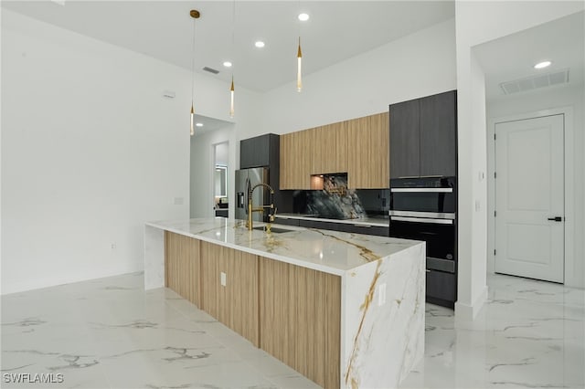 103 Chiquita Blvd N, Cape Coral, FL 33993 - kitchen with appliances with stainless steel finishes, a sink, modern cabinets, light marble finish flooring, and recessed lighting