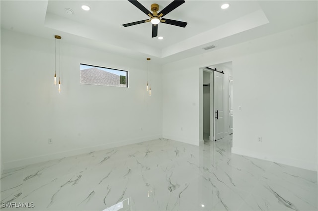 103 Chiquita Blvd N, Cape Coral, FL 33993 - unfurnished room with baseboards, a raised ceiling, recessed lighting, a barn door, and a ceiling fan