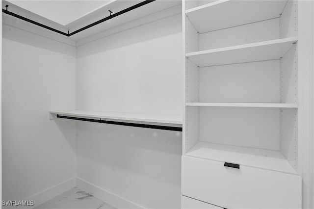 103 Chiquita Blvd N, Cape Coral, FL 33993 - walk in closet with marble look tile flooring