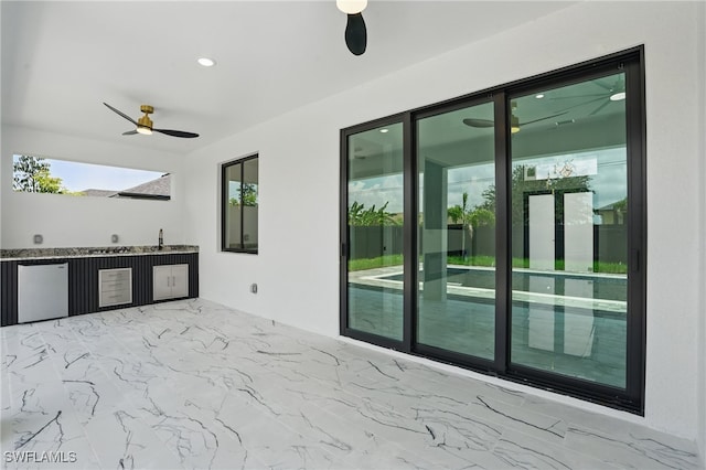 103 Chiquita Blvd N, Cape Coral, FL 33993 - view of patio with a ceiling fan, an outdoor kitchen, and a sink