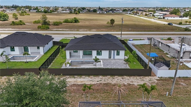 103 Chiquita Blvd N, Cape Coral, FL 33993 - rear view of property with a fenced backyard, a patio, and a residential view