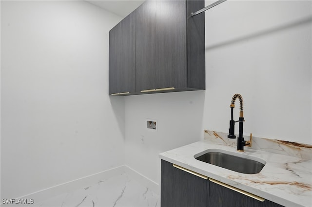 103 Chiquita Blvd N, Cape Coral, FL 33993 - laundry area with cabinet space, light marble finish flooring, hookup for a washing machine, and baseboards