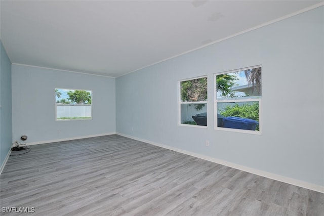 4370 Deleon St, Fort Myers, FL 33901 - spare room with wood finished floors, baseboards, and crown molding