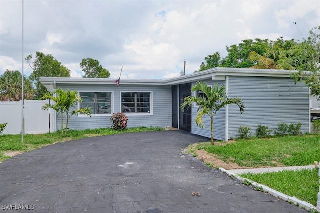 4370 Deleon St, Fort Myers, FL 33901 - view of front of property featuring driveway and fence