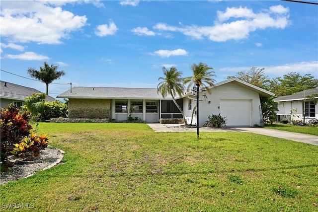 view of front facade featuring a garage, driveway, and a front yard
