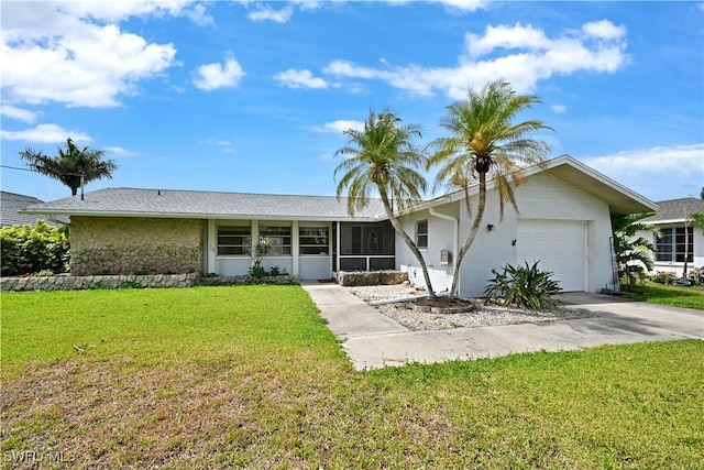 single story home featuring a garage, concrete driveway, a front yard, stone siding, and stucco siding