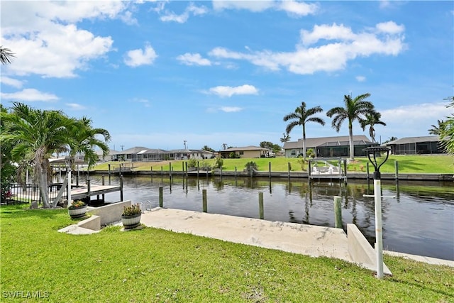 dock featuring a residential view, a water view, and a lawn