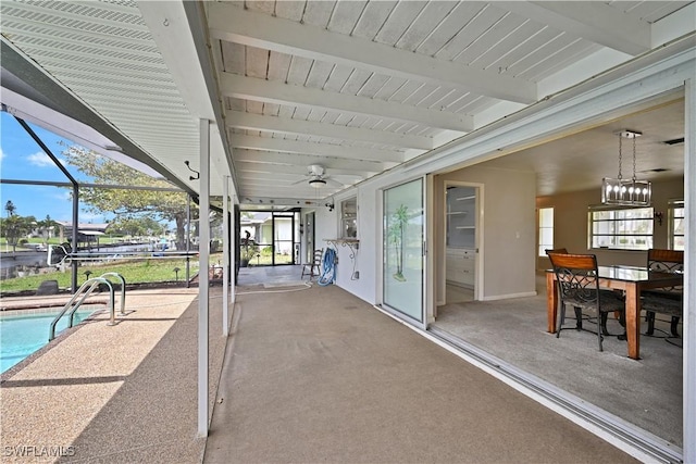 view of patio with ceiling fan, an outdoor pool, and a lanai
