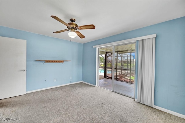 carpeted empty room with baseboards and ceiling fan