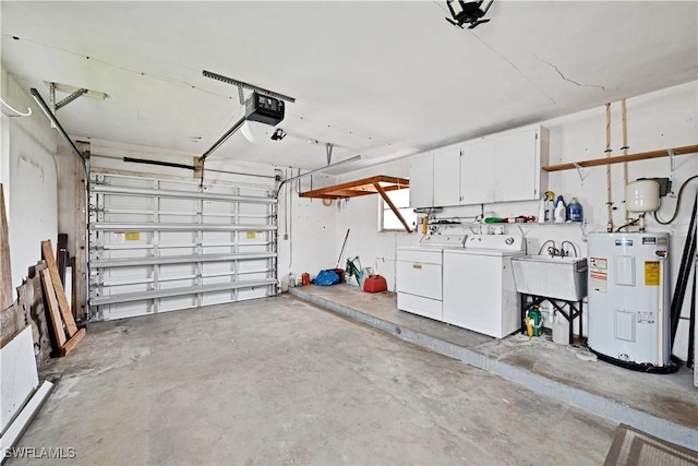 garage with electric water heater, washer and dryer, a sink, and a garage door opener