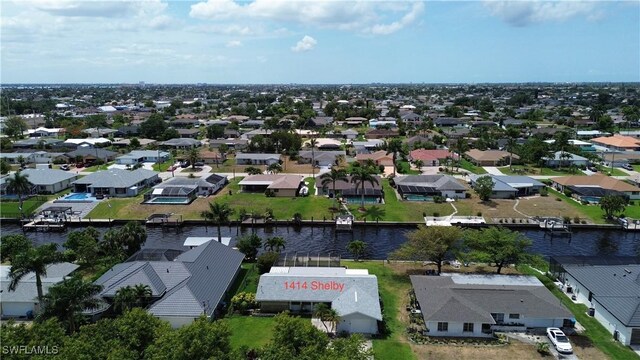 aerial view of residential area with a nearby body of water