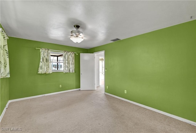 1414 Shelby Pkwy, Cape Coral, FL 33904 - unfurnished room featuring a ceiling fan, baseboards, and carpet