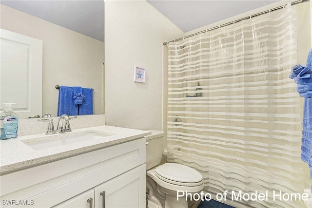 full bath featuring toilet, vanity, and curtained shower