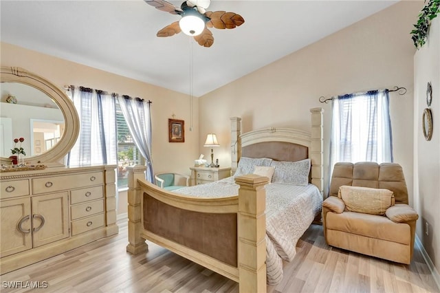 8012 Sivon Way Unit 902, Naples, FL 34119 - bedroom with light wood finished floors, baseboards, ceiling fan, and vaulted ceiling