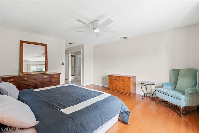 430 Meadowlark Ln Unit 430B, Naples, FL 34105 - bedroom featuring wood finished floors, a ceiling fan, and baseboards