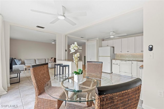 430 Meadowlark Ln Unit 430B, Naples, FL 34105 - dining room with ceiling fan and light tile patterned floors