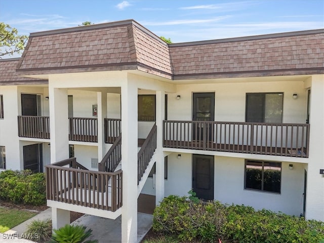 view of property featuring stairway