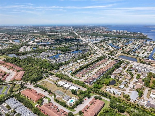 aerial overview of property's location featuring a large body of water and nearby suburban area