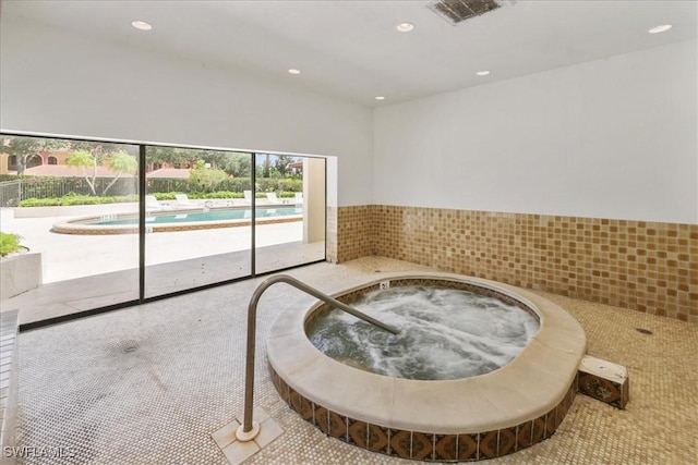 interior space with recessed lighting and wainscoting