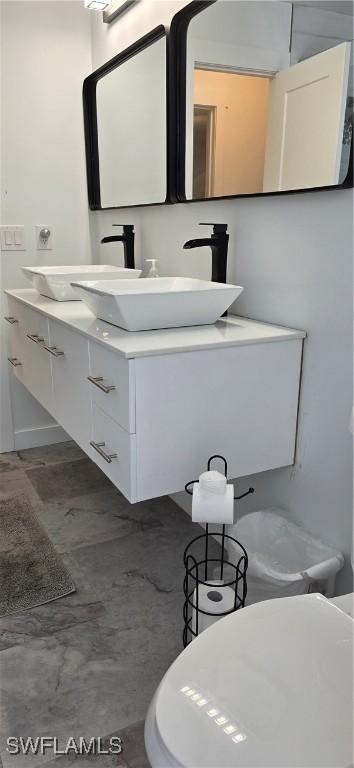 half bathroom featuring vanity