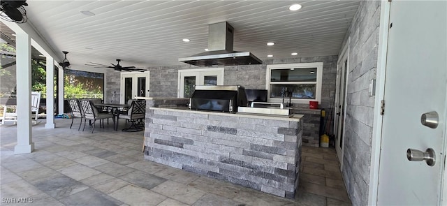 view of patio / terrace with exterior kitchen, outdoor dining space, a ceiling fan, french doors, and a grill