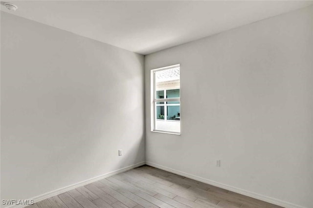 44311 Panther Dr, Punta Gorda, FL 33982 - unfurnished room featuring light wood-style flooring and a smoke detector