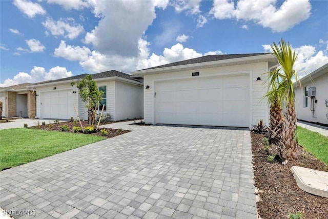 44311 Panther Dr, Punta Gorda, FL 33982 - single story home with decorative driveway, a front yard, and a garage