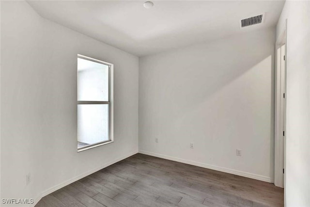 44311 Panther Dr, Punta Gorda, FL 33982 - spare room featuring wood finished floors and baseboards