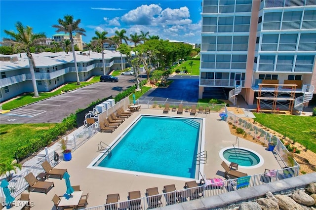 1020 S Collier Blvd Unit 402, Marco Island, FL 34145 - community pool featuring a community hot tub