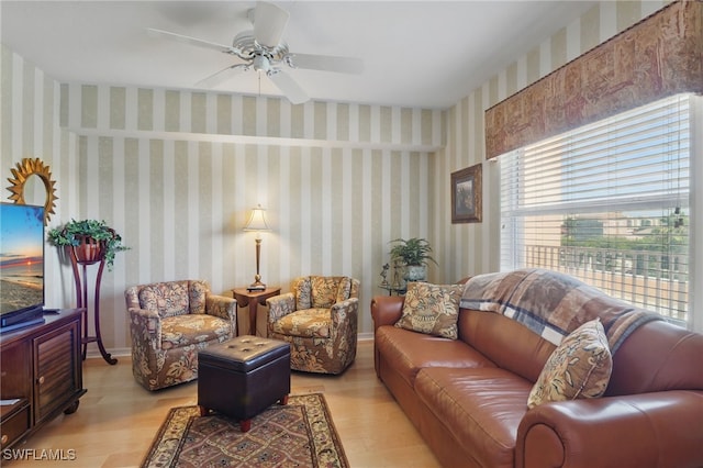 1020 S Collier Blvd Unit 402, Marco Island, FL 34145 - living area with light wood finished floors, healthy amount of natural light, and ceiling fan