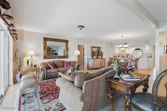 1020 S Collier Blvd Unit 402, Marco Island, FL 34145 - living room featuring a chandelier and light tile patterned floors
