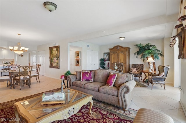 1020 S Collier Blvd Unit 402, Marco Island, FL 34145 - living area with light tile patterned floors, a chandelier, and baseboards