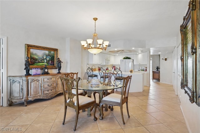 1020 S Collier Blvd Unit 402, Marco Island, FL 34145 - dining space featuring a chandelier, light tile patterned flooring, and baseboards