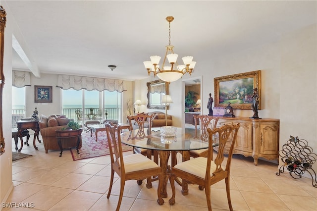 1020 S Collier Blvd Unit 402, Marco Island, FL 34145 - dining space with light tile patterned flooring and a chandelier