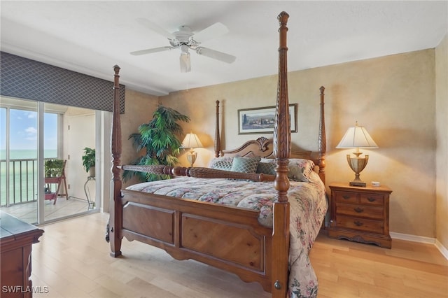 1020 S Collier Blvd Unit 402, Marco Island, FL 34145 - bedroom with access to exterior, wood finished floors, a ceiling fan, and baseboards