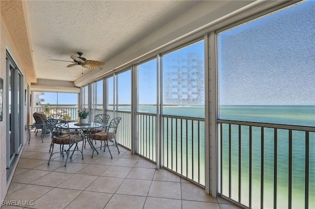 1020 S Collier Blvd Unit 402, Marco Island, FL 34145 - sunroom with a water view and ceiling fan