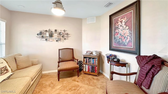 sitting room featuring baseboards