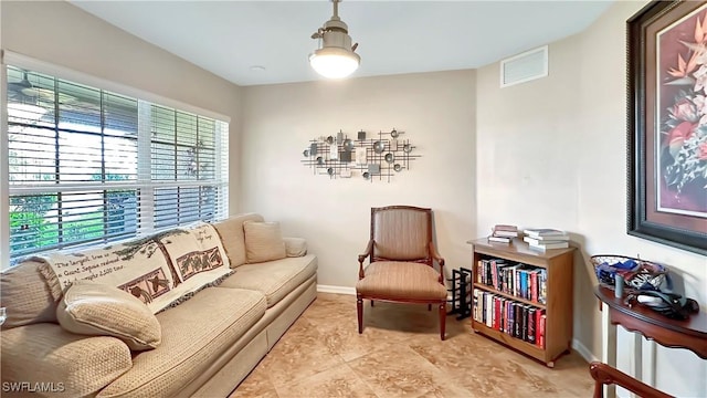 sitting room featuring baseboards