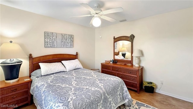 bedroom with baseboards and ceiling fan