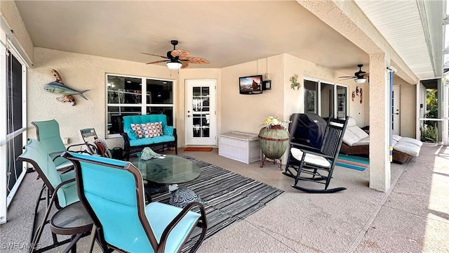 view of patio / terrace featuring a ceiling fan and an outdoor living space