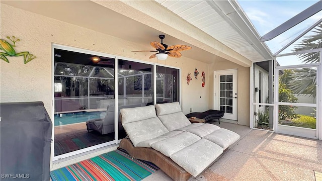 sunroom with ceiling fan
