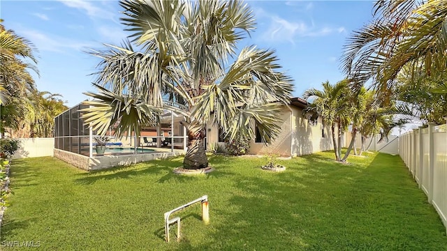 view of yard with a lanai
