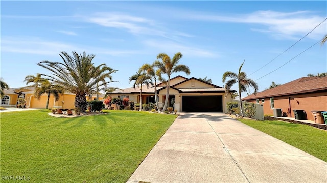 single story home with a garage, concrete driveway, a front lawn, and stucco siding