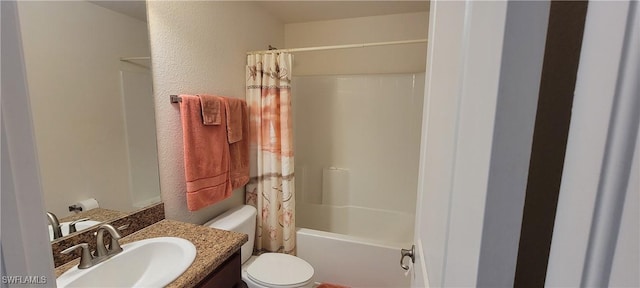 bathroom with toilet, a textured wall, vanity, and shower / bath combination with curtain