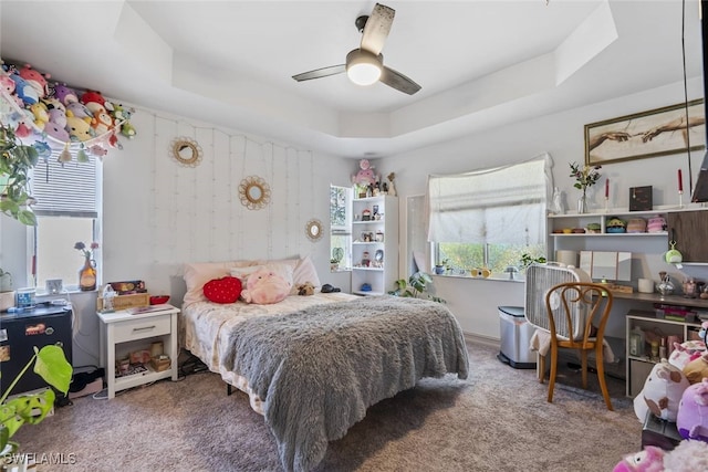 857 Bedford Dr, Lehigh Acres, FL 33974 - bedroom with a tray ceiling, carpet, a ceiling fan, and a desk