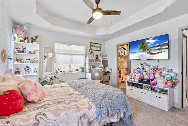 857 Bedford Dr, Lehigh Acres, FL 33974 - carpeted bedroom featuring a raised ceiling and ceiling fan