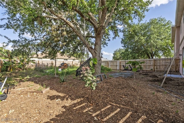 857 Bedford Dr, Lehigh Acres, FL 33974 - fenced backyard with a garden